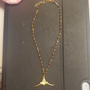 Elegant Gold Necklace with Bird Pendant